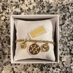 Michael Kors Gold charm bracelet— never worn